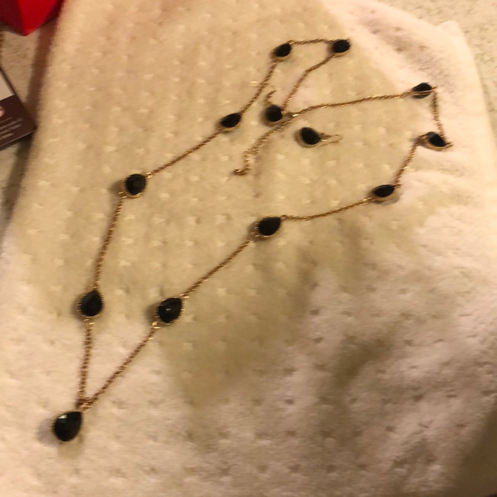 A black necklace with matching earrings 🖤